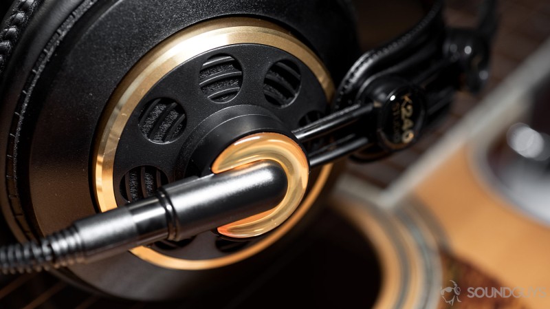 A photo of the AKG K240 Studio semi-open headphones with the left ear cup in focus.